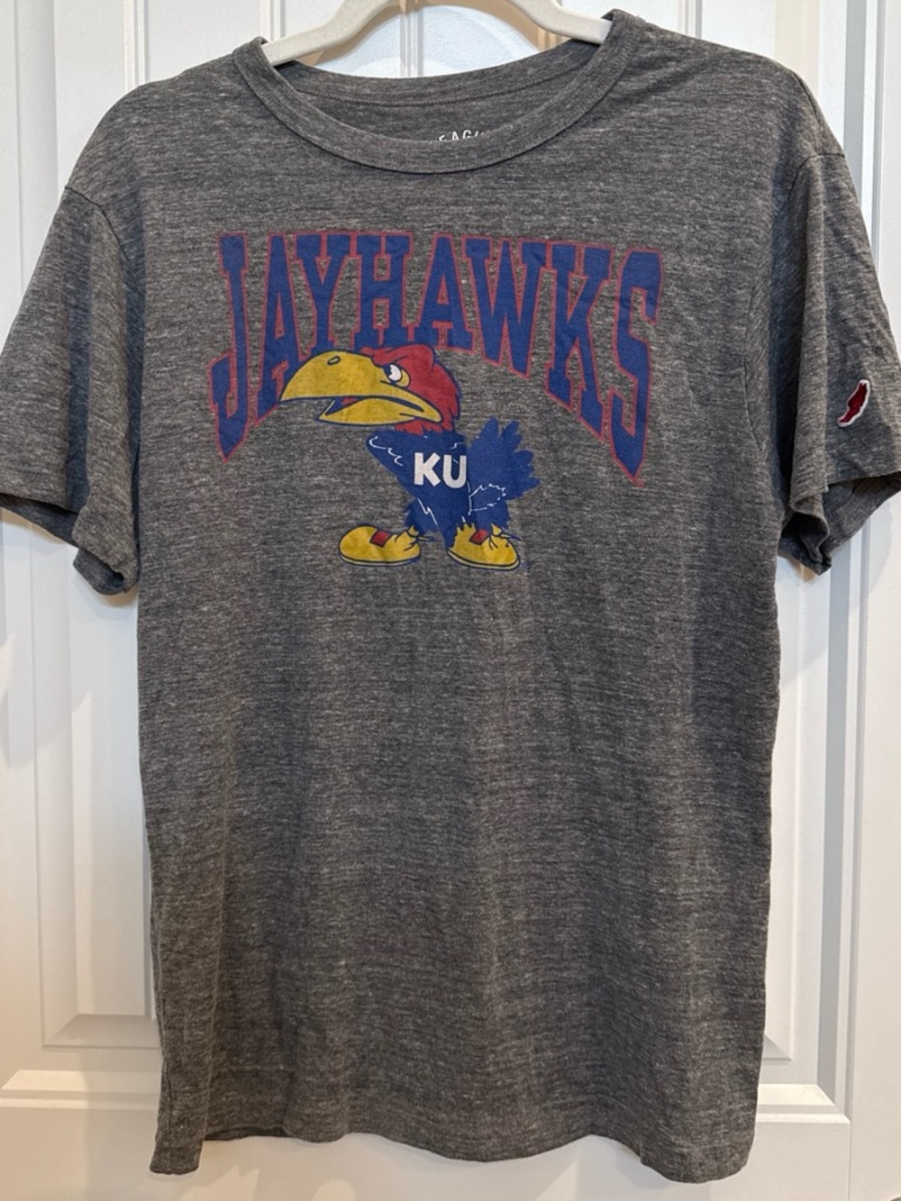 League Gray Jayhawks Graphic Tee with Blue, Red and Yellow Logo
